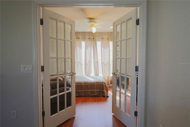 bedroom featuring wood-type flooring and french doors