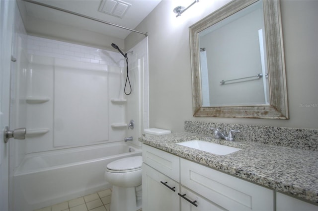 bathroom with toilet, vanity, tile patterned flooring, and tub / shower combination