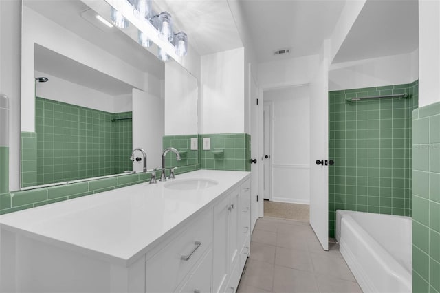 bathroom with vanity, bathtub / shower combination, tile patterned flooring, and visible vents