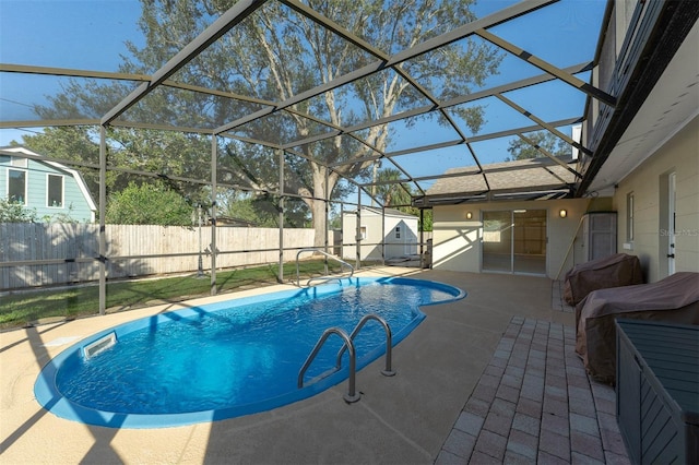 view of pool featuring a lanai, a patio area, a fenced backyard, and a fenced in pool