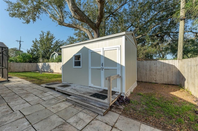 view of shed with a fenced backyard