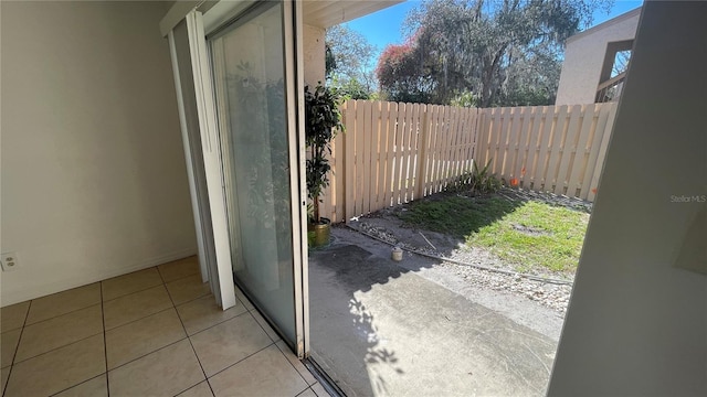 doorway to outside featuring light tile patterned floors