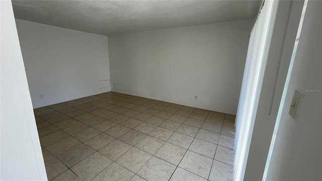 spare room featuring a textured ceiling