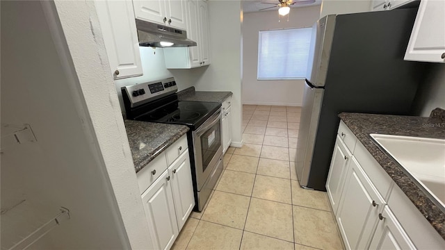 kitchen featuring sink, light tile patterned floors, ceiling fan, stainless steel appliances, and white cabinets