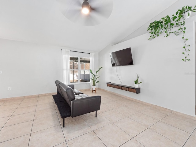 tiled living room featuring lofted ceiling and ceiling fan