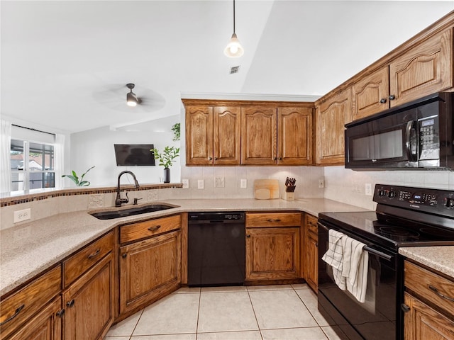 kitchen featuring vaulted ceiling, sink, decorative backsplash, light tile patterned floors, and black appliances