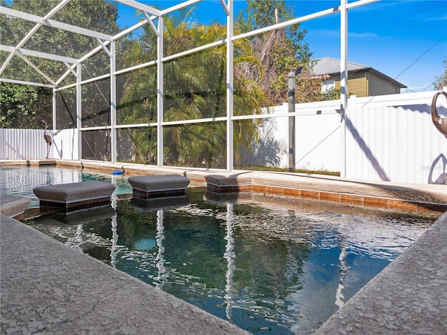 view of pool featuring a lanai