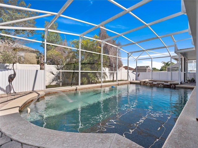 view of pool featuring a patio area and glass enclosure