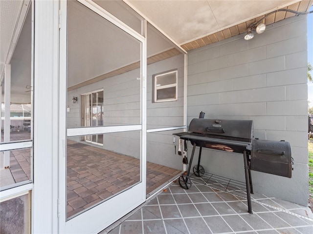 misc room with tile patterned floors