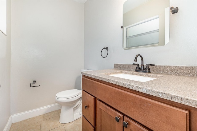 bathroom with vanity, tile patterned floors, and toilet