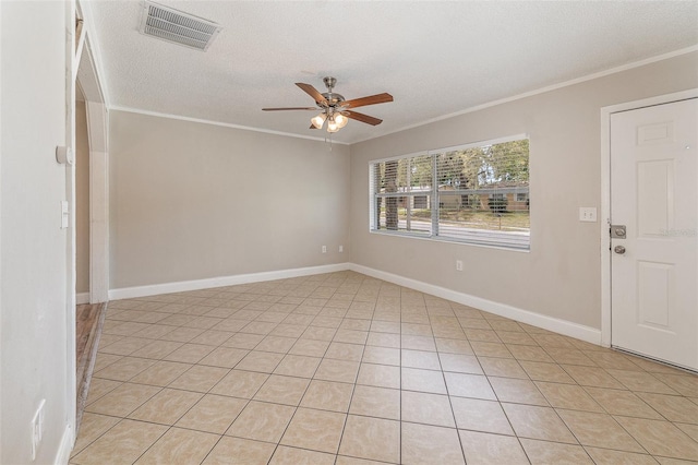 empty room with a textured ceiling, ornamental molding, and ceiling fan