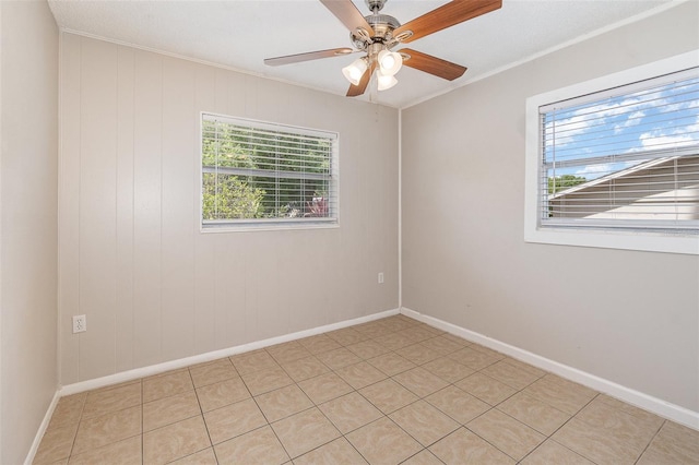 unfurnished room featuring crown molding and ceiling fan