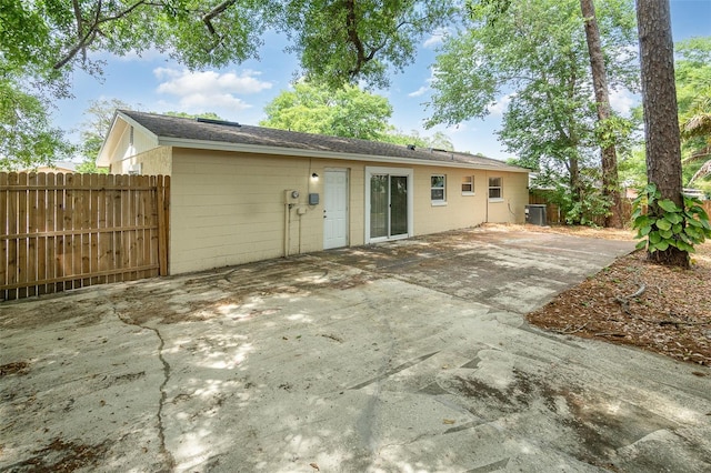 rear view of house featuring central AC and a patio