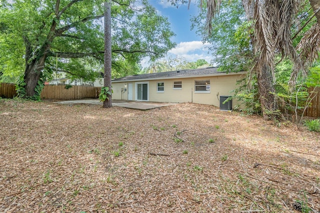 back of property featuring central AC and a patio area