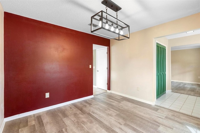 unfurnished dining area featuring light wood-type flooring