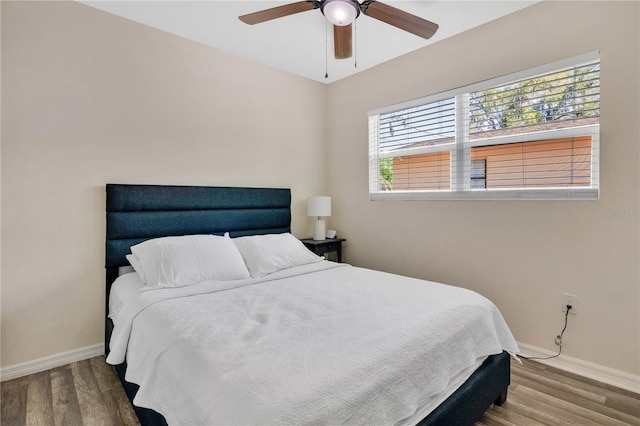 bedroom featuring ceiling fan and wood-type flooring