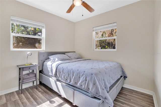 bedroom featuring hardwood / wood-style flooring and ceiling fan