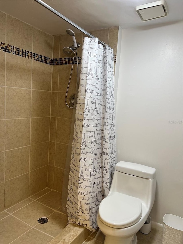 bathroom with a shower with curtain and toilet