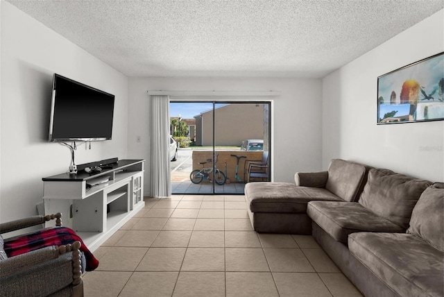 5201 Vineland Rd Unit 112, Orlando, FL 32811 - living area featuring tile patterned flooring and a textured ceiling