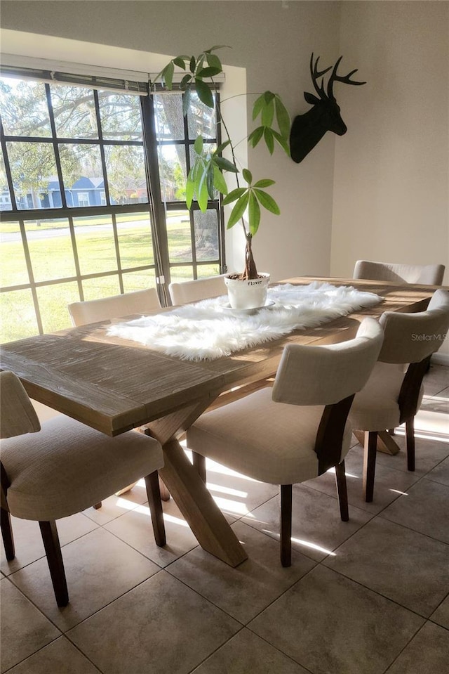 dining area featuring tile patterned flooring