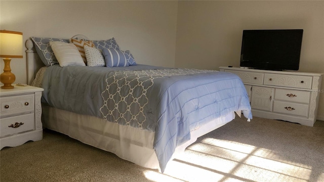 bedroom with light colored carpet