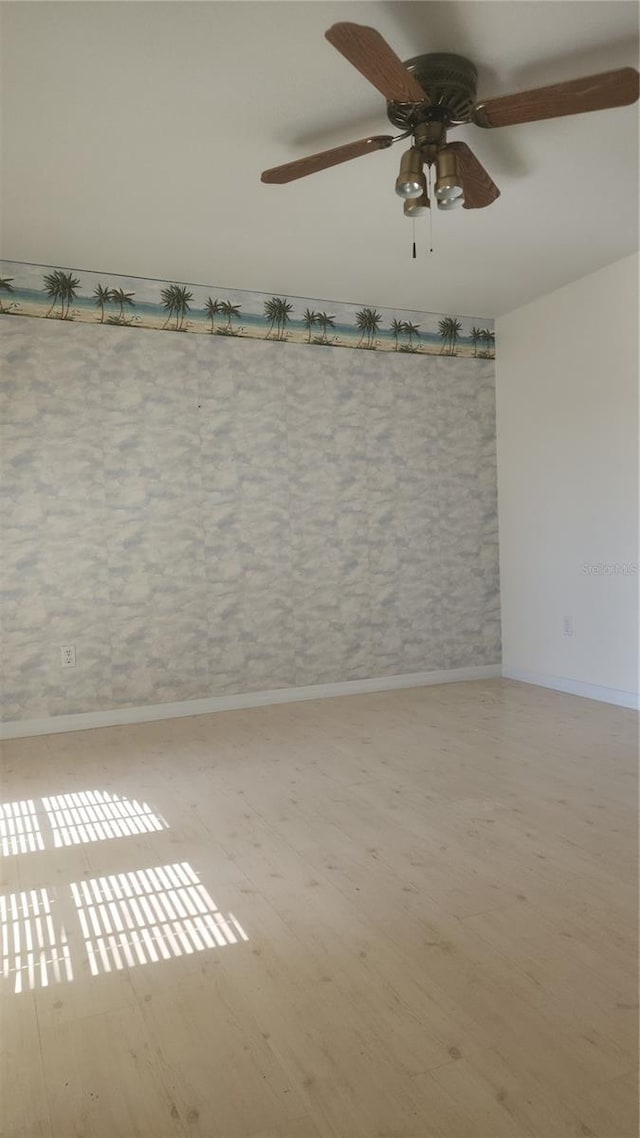 empty room with light hardwood / wood-style flooring