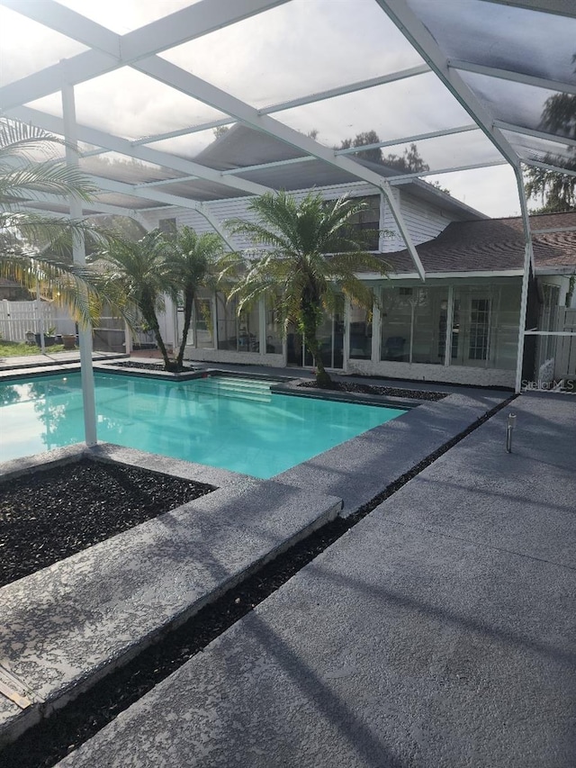 view of pool featuring a patio area and a lanai