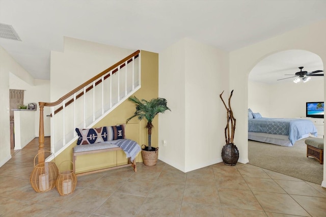 11419 Donneymoor Dr, Riverview, FL 33569 - tiled entryway featuring a ceiling fan, stairway, and arched walkways