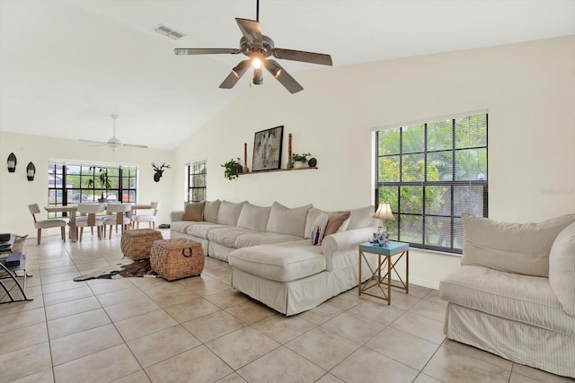 11419 Donneymoor Dr, Riverview, FL 33569 - living room featuring light tile patterned flooring, ceiling fan, and vaulted ceiling