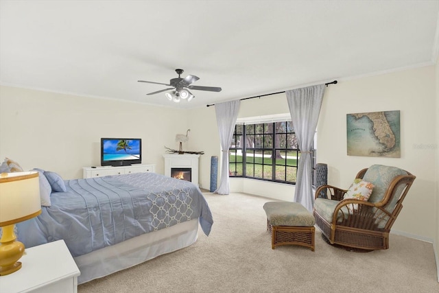 11419 Donneymoor Dr, Riverview, FL 33569 - carpeted bedroom featuring ceiling fan, a lit fireplace, and ornamental molding