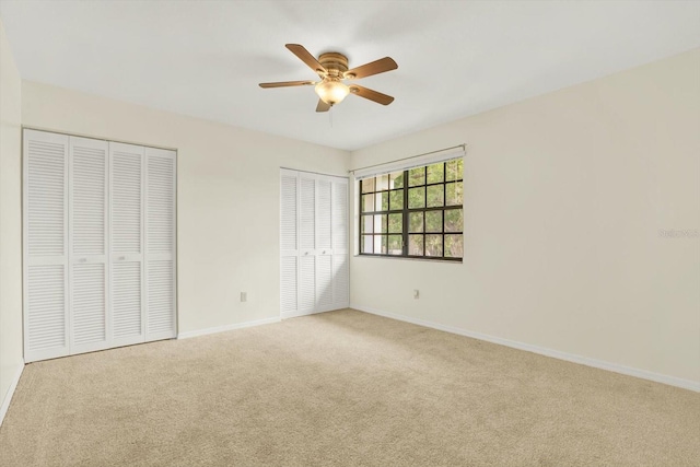 11419 Donneymoor Dr, Riverview, FL 33569 - unfurnished bedroom featuring carpet, two closets, and a ceiling fan