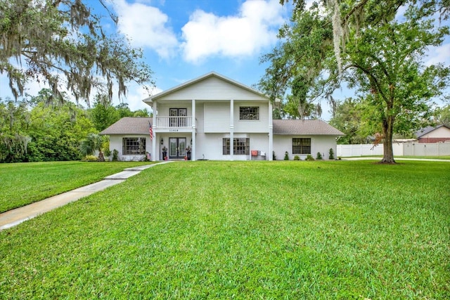 11419 Donneymoor Dr, Riverview, FL 33569 - view of front facade with a balcony, french doors, and stucco siding
