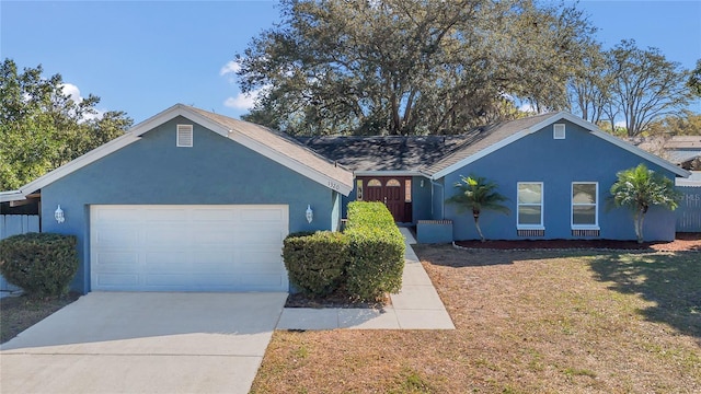 single story home featuring a front yard and a garage