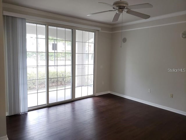 spare room with crown molding, ceiling fan, and dark hardwood / wood-style flooring