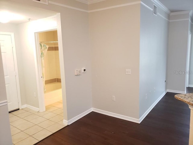 hall featuring ornamental molding and light wood-type flooring