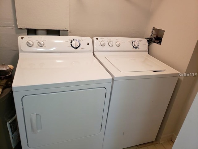 laundry area with independent washer and dryer