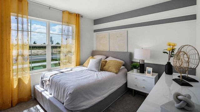 bedroom featuring dark colored carpet