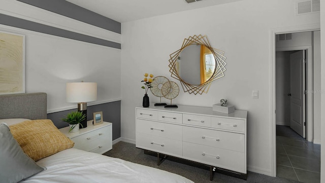 bedroom with dark colored carpet