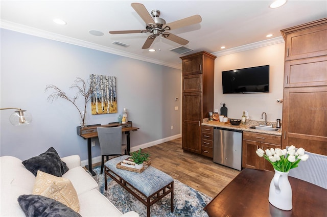 living area featuring recessed lighting, visible vents, ornamental molding, light wood-type flooring, and wet bar