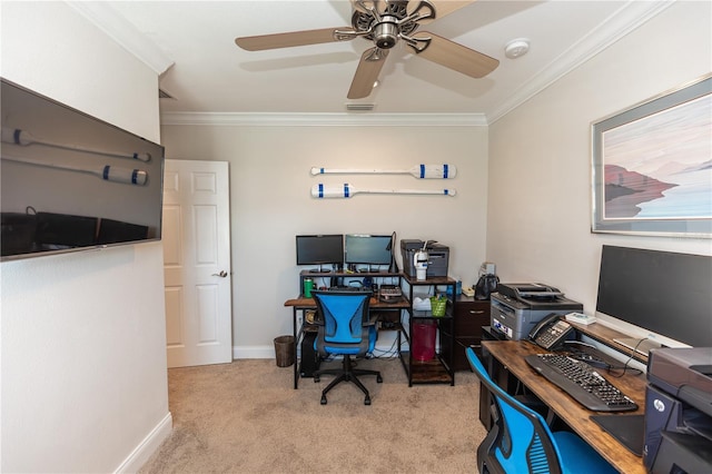 home office with crown molding, visible vents, light carpet, ceiling fan, and baseboards