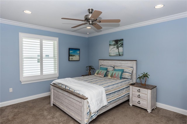 bedroom featuring baseboards, dark colored carpet, and crown molding