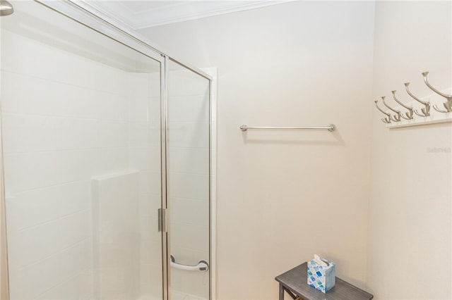 full bath featuring a shower stall and crown molding