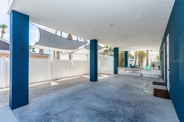 view of patio featuring fence