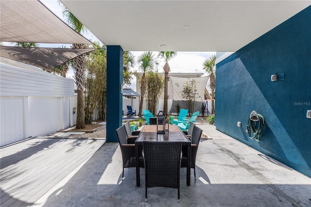 view of patio featuring a fenced backyard and outdoor dining space