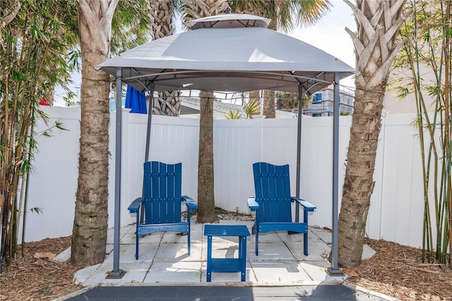 view of patio / terrace featuring fence and a gazebo