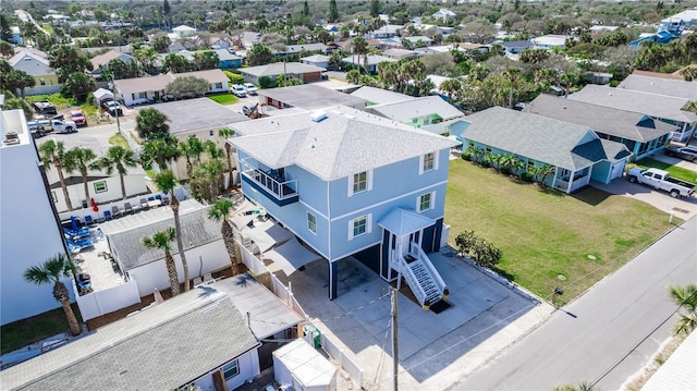 birds eye view of property with a residential view