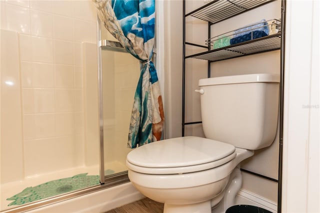 full bath with a shower stall and toilet