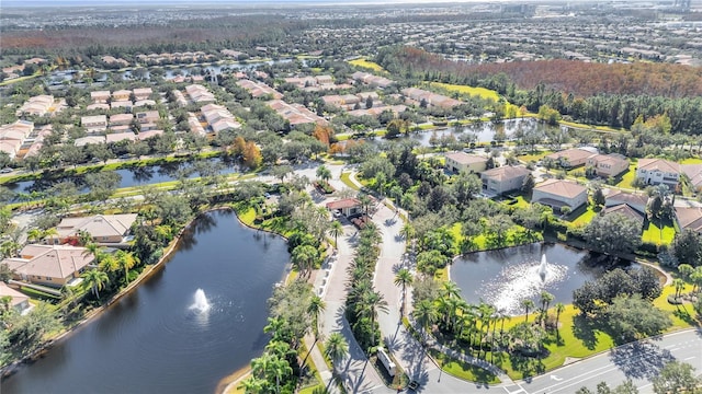 bird's eye view with a residential view and a water view