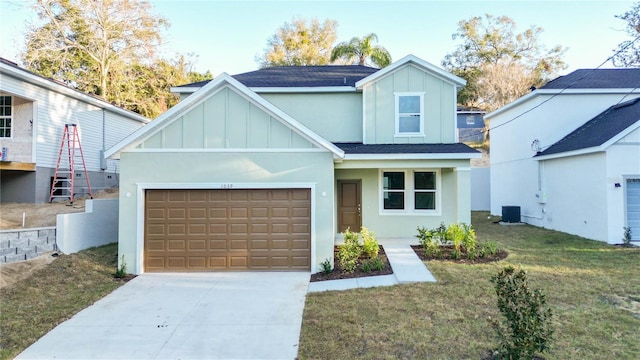 view of front of home featuring a front lawn and central air condition unit