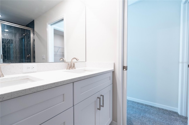 bathroom featuring vanity and a shower with shower door